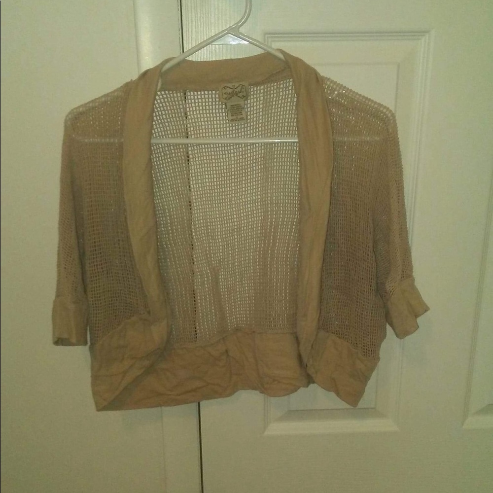 Tan shrug